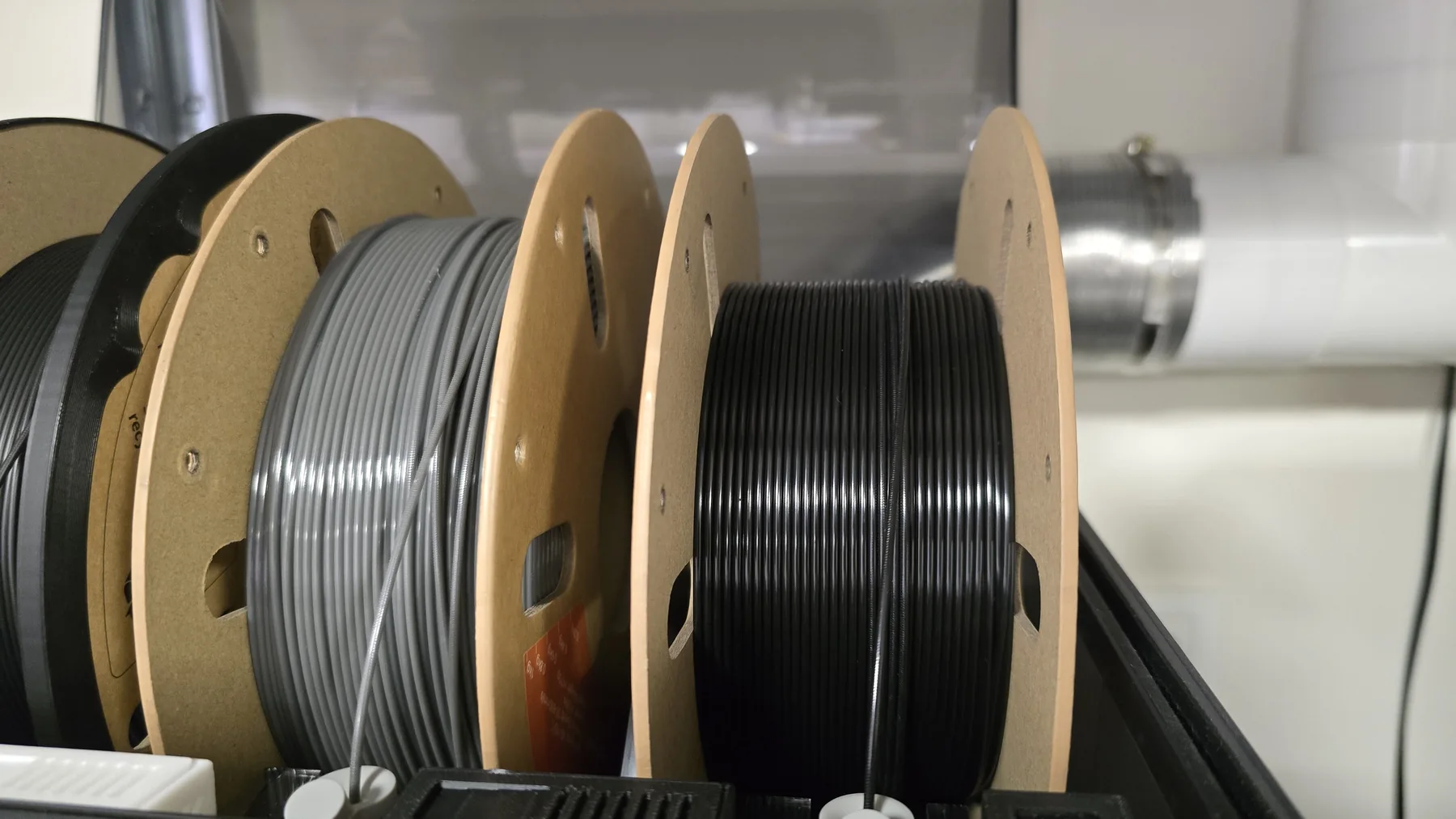 Spools of gray and black filament