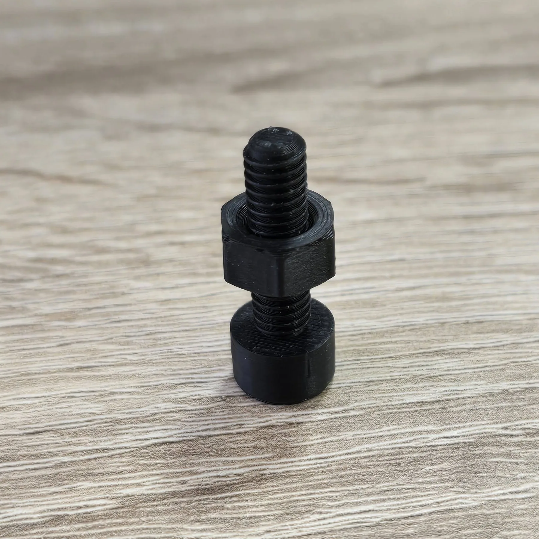 Black 3D printed threaded part