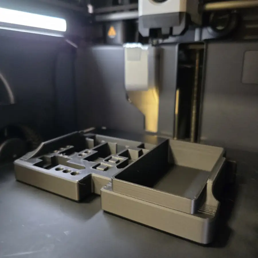 3D printed part on a printer build plate